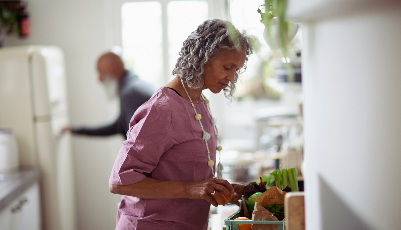 Person preparing food in a bright kitchen.